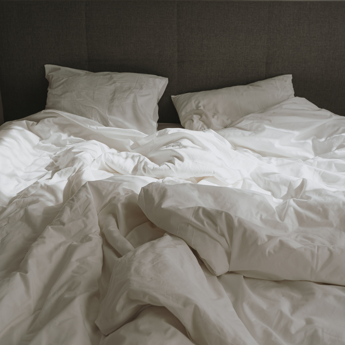 Crumpled White Blanket on the Bed